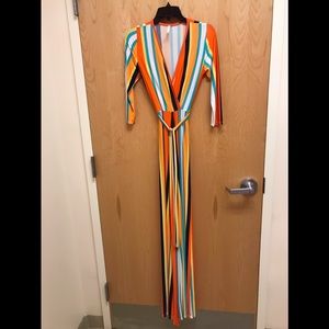 Gently worn sexy long-sleeved fitted stripped jumpsuit w/ belt